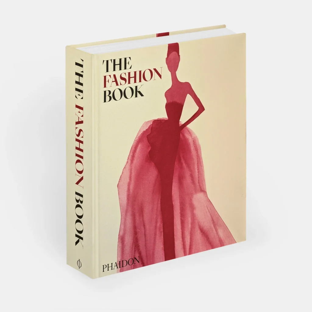 A fashion book with a stylized illustration of a model in a flowing red gown on the cover.